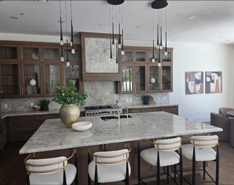 North Scottsdale residential kitchen with a veined stone island and backsplash, shown as a fabrication example rather than a commercial project